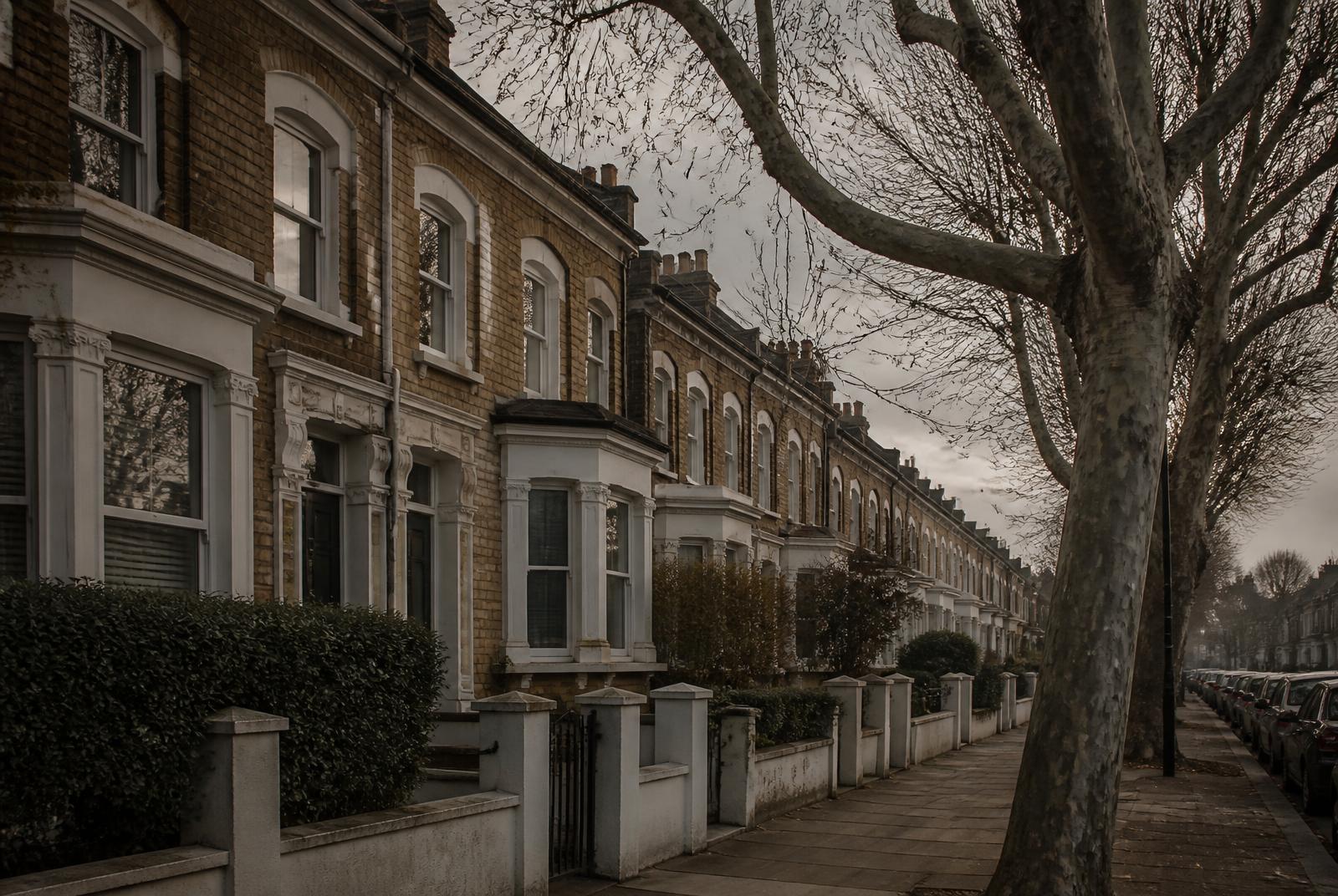 North London street lined with brick terraces and trees